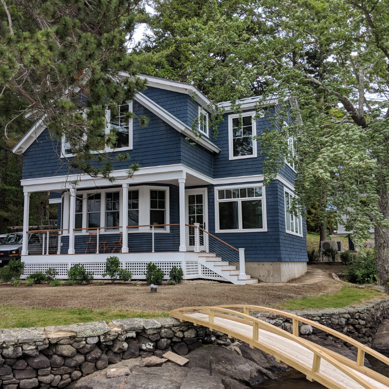 blue house with white trim called "Sweetwater" after a remodel in Camden, ME